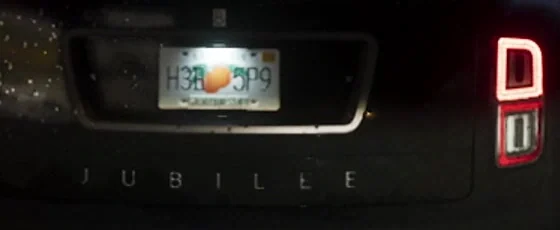 Close crop of the rear door showing JUBILEE below the license plate, without a legible full brand name