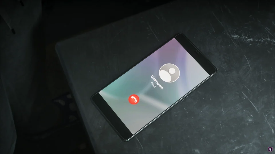 Smartphone on a metal table showing a call from Unknown, a 01:01 timer and a red hang-up button