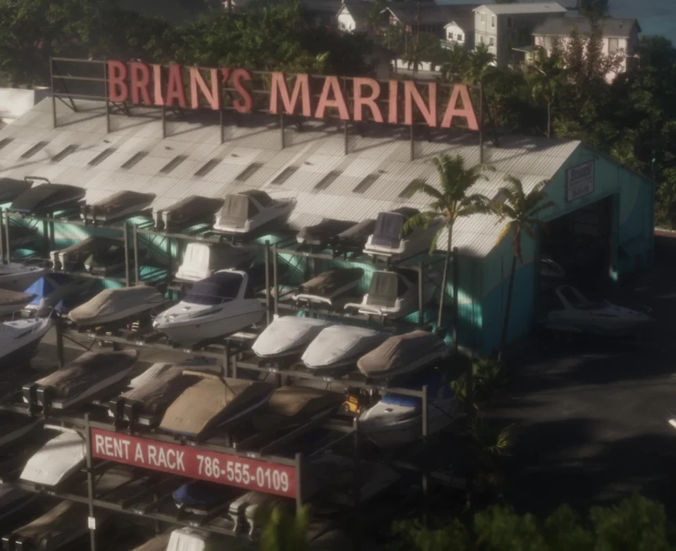 Boats on multilevel racks at Brian's Marina, with a Rent a Rack sign below